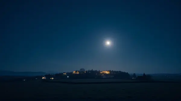 Moonlit Village Under Deep Blue Sky