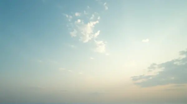 Wide open landscape viewed from low horizon with vapor formations casting gentle light above