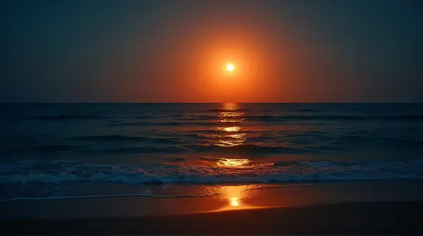 Orange Lunar Glow Over Ocean Ripples