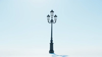 Ornate Black Metal Lamp Post Against Clear Sky
