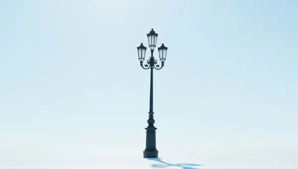 Ornate Black Metal Lamp Post Against Clear Sky