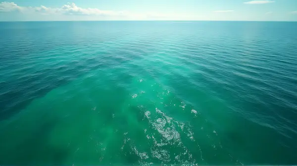 Overhead View Of Expansive Emerald Sea Currents