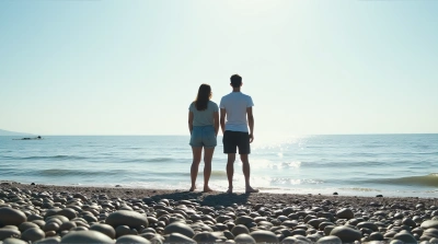 People Standing On Pebble Shoreline With Calm Sea