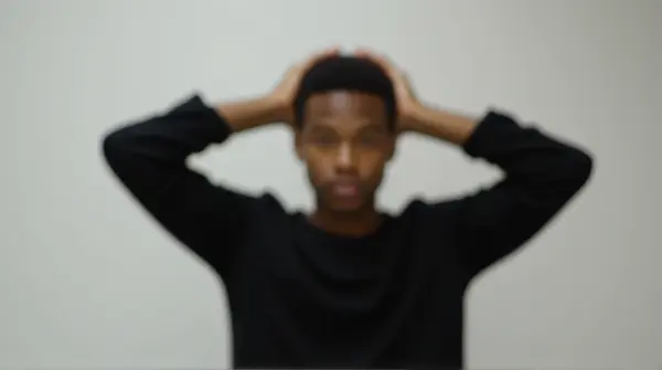 Person Stretching Arms Upward In Black Shirt