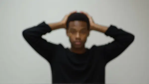 Person Stretching Arms Upward In Black Shirt
