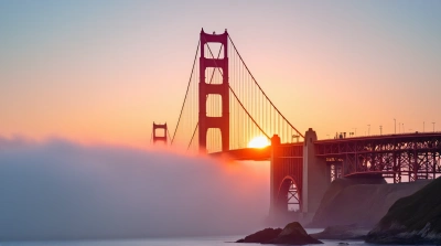 Red Suspension Bridge Over Foggy Bay Sunrise