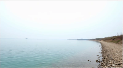 Rippling Water Surface Near Pebble Shoreline