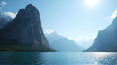 Rocky Peak Near Shimmering Lake Under Clear Sky