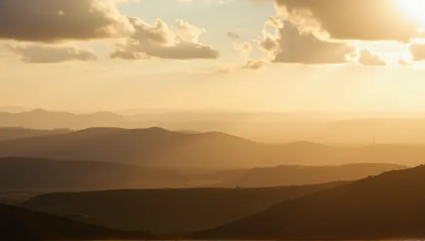 Rolling Hills Landscape Under Warm Golden Hour Light