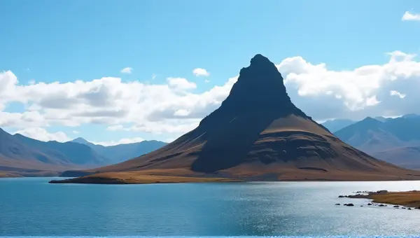 Rugged Brown Peak Near Shimmering Lake Scenic View