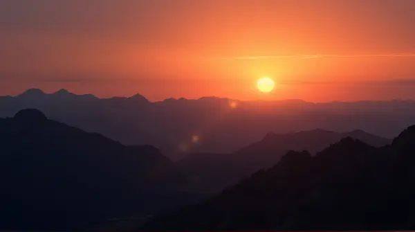Rugged Highlands Under Vibrant Twilight Sky