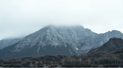 Rugged Mountain Range Under Overcast Sky