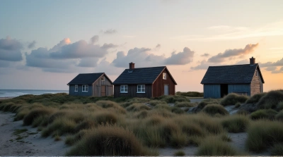 Rustic Cottages By Calm Coastal Shoreline Evening