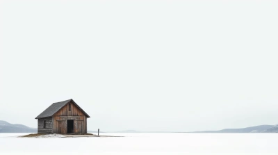 Rustic Timber Hut Amid Expansive White Terrain