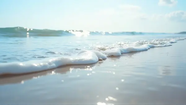 Saltwater Surges Rolling Toward Sandy Beach
