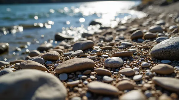 Scattered Gravel Stones Near Flowing River Edge