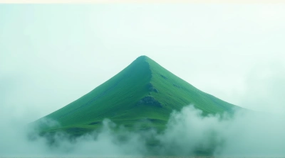 Sharp Emerald Peak Under Soft Overcast Sky