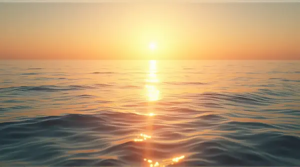 Shimmering water with gentle ripples and soft golden light casting long shadows at the horizon