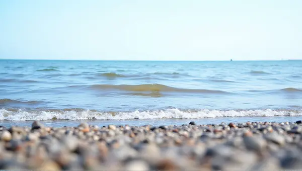 Shoreline Water Patterns Over Pebbled Terrain