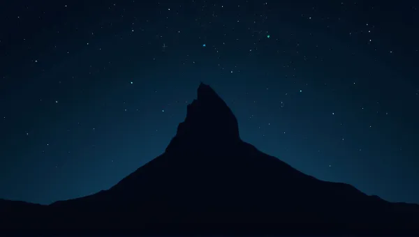 Silhouetted Summit Against Twinkling Night Sky