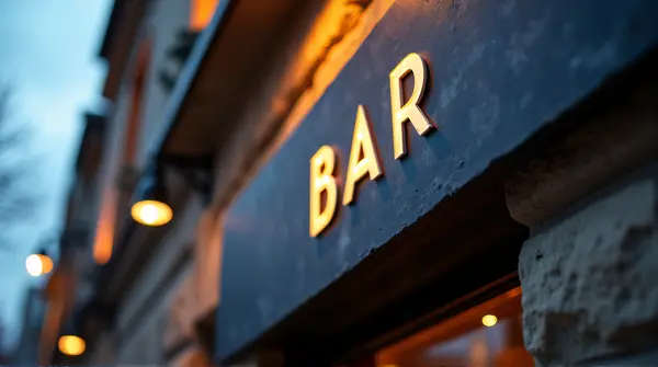 Slate Bar Sign With Ambient Lighting At Dusk