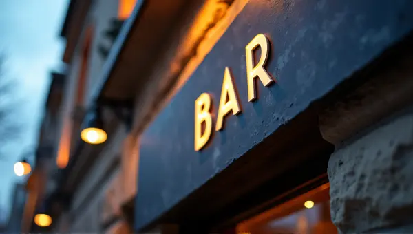 Slate Bar Sign With Ambient Lighting At Dusk