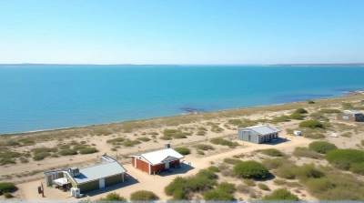 Small Buildings Beside Large Blue Water Body