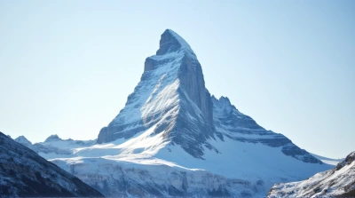 Snow-Covered Mountain Under Clear Blue Sky