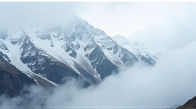 Snowy Mountain Slopes Above Misty Valley