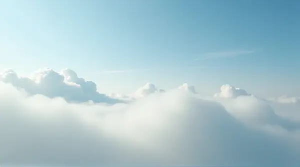 Low angle view of soft-edged vapor formations stretching broadly across the sky.