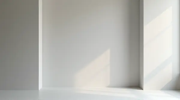 Solid panel blocking a passage framed by smooth walls with soft shadow edges viewed straight-on.