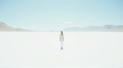 Solitary Person On Vast White Landscape Under Clear Sky