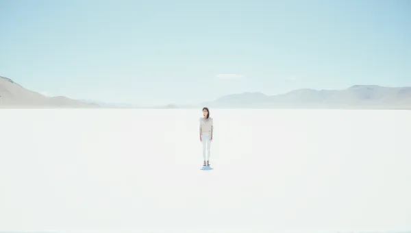 Solitary Person On Vast White Landscape Under Clear Sky