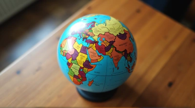 Spherical World Map Showing Country Borders On Table