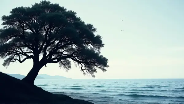 Sprawling Oak Tree Beside Tranquil Water Body
