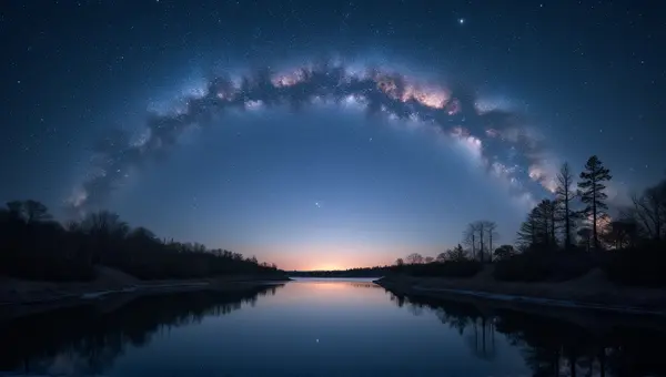 Starry Sky Over Peaceful Water And Wooded Shore