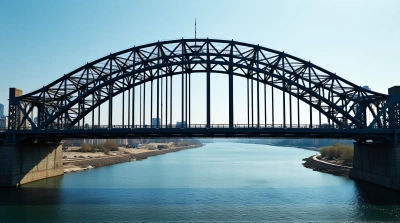 Steel Arch Bridge Over Calm Waterway