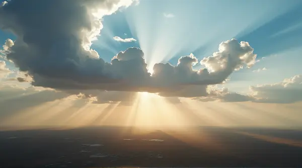 Sunbeams Casting Shadows Over Expansive Landscape