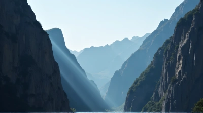 Sunlight Piercing Rocky Cliffs With Clear Sky