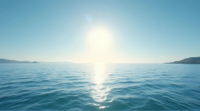 Sunlit Ocean Waves Under Open Sky Horizon