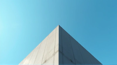 Tall Gray Facade Against Clear Cerulean Sky