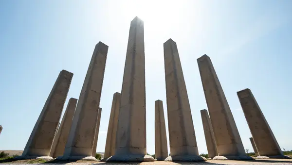 Tall Stone Pillars Under Expansive Sky