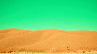 Tawny Terrain Texture Beneath Emerald Sky Horizon