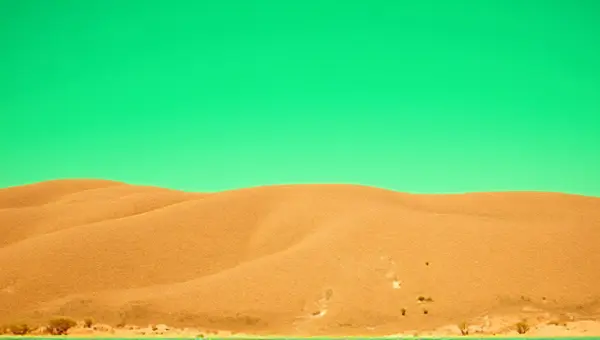 Tawny Terrain Texture Beneath Emerald Sky Horizon
