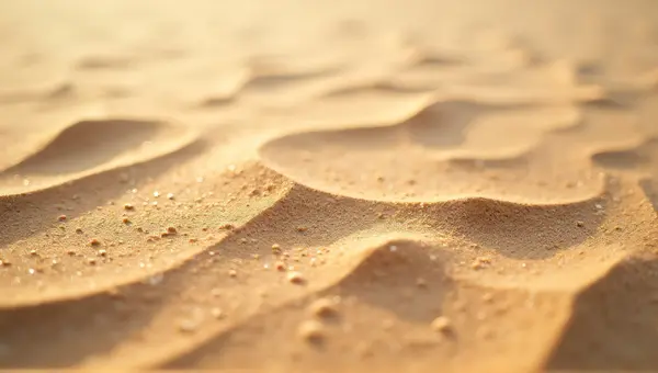 Textured Brown Sand Surface With Granular Patterns