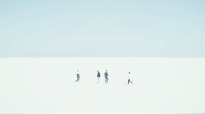 Three Figures Crossing Expansive White Landscape