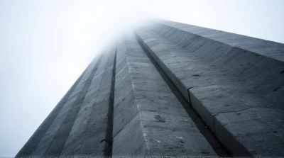 Towering Gray Facade Against Overcast Sky