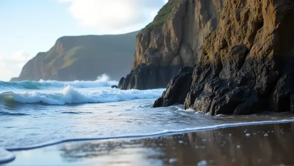 Towering Stone Pillars Along Ocean Edge With Waves