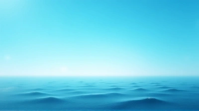 Tranquil Sea Under Clear Sky At Sunrise