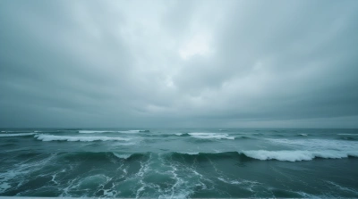 Turbulent Ocean Waters Beneath Layered Gray Sky